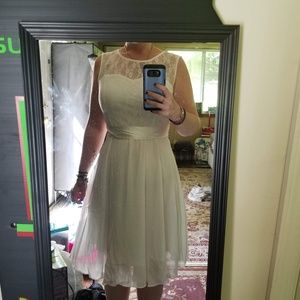 White knee length dress w/ black tulle underskirt